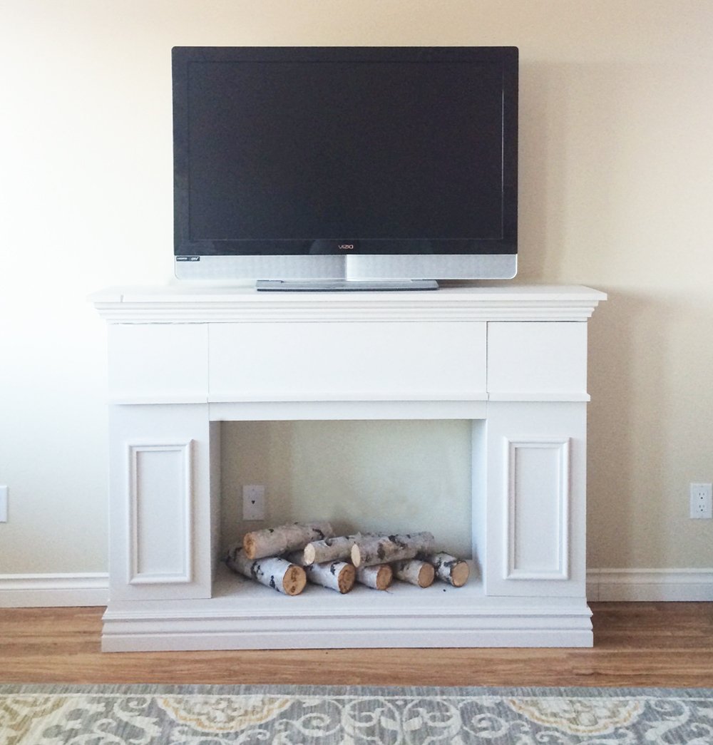 White faux fireplace on sale tv stand